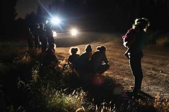MCALLEN, TX - JUNE 12:  U.S. Border Patrol agents arrive to detain a group of Central American asylum seekers near the U.S.-Mexico border on June 12, 2018 in McAllen, Texas. The group of women and children had rafted across the Rio Grande from Mexico and were detained before being sent to a processing center for possible separation. Customs and Border Protection (CBP) is executing the Trump administration's "zero tolerance" policy towards undocumented immigrants. U.S. Attorney General Jeff Sessions also said that domestic and gang violence in immigrants' country of origin would no longer qualify them for political asylum status.  (Photo by John Moore/Getty Images)